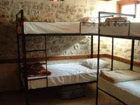 Bed in a economy dormitory with shared facilities